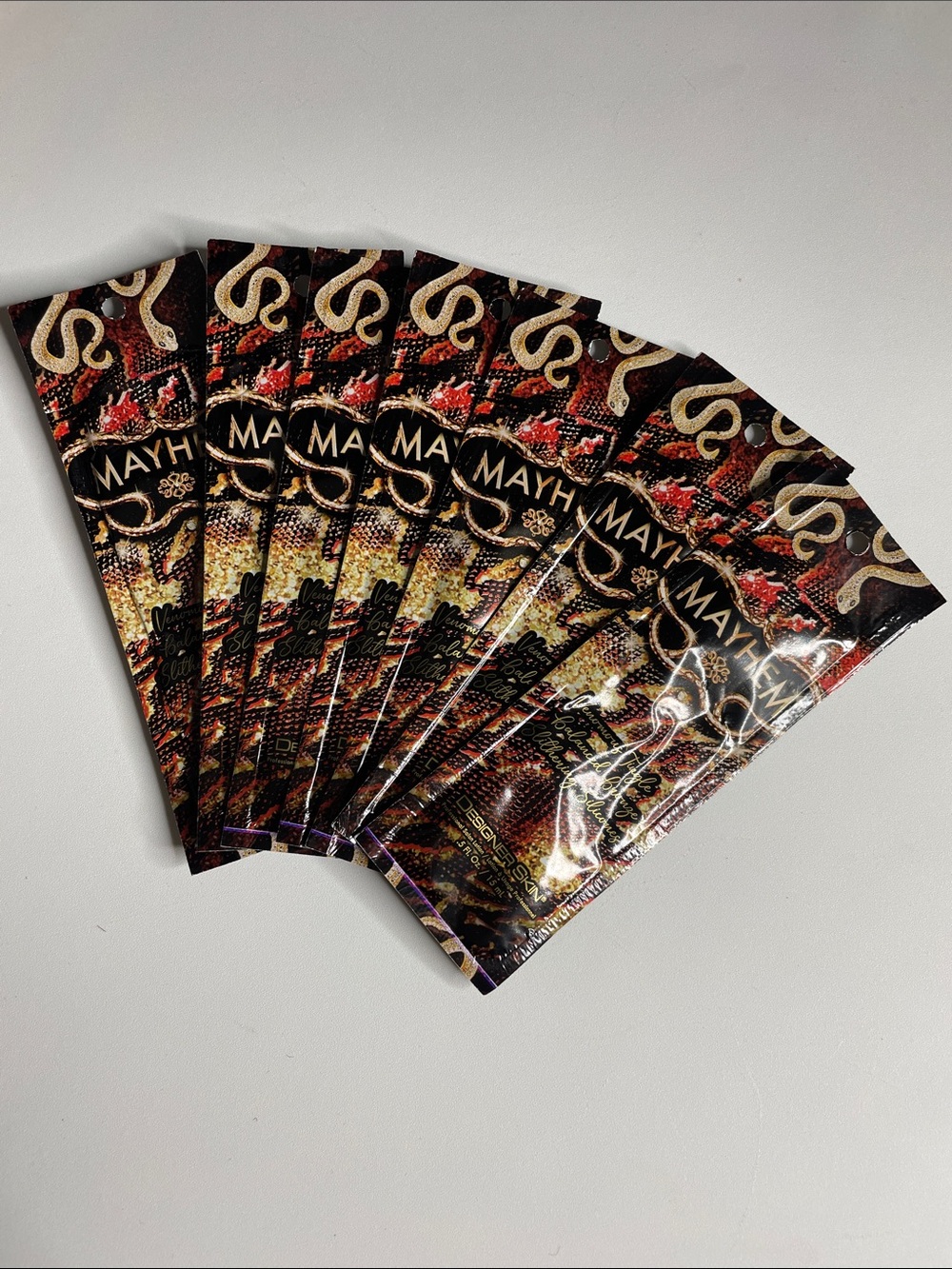 Mayhem Tanning Lotion- Red, Black & Gold Accents